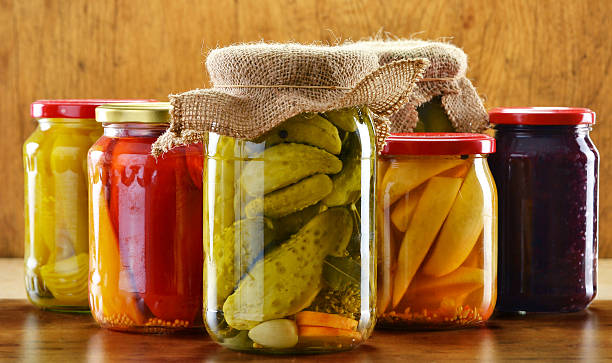 istock Composition with jars of pickled vegetables on wooden background 149465234