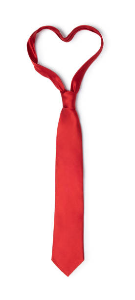 This is a conceptual symbol for Father's day with a red tie in the shape of a heart isolated on a white background
