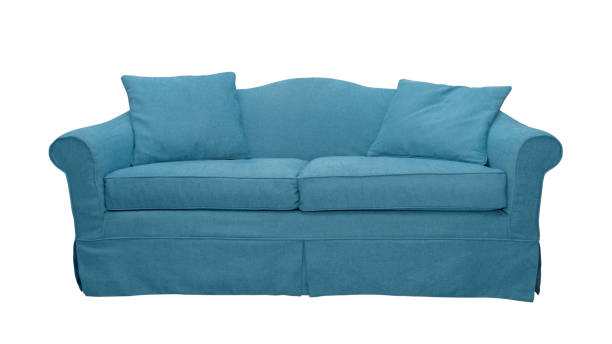 istock Cyan sofa with pillows isolated on white background 1494654224