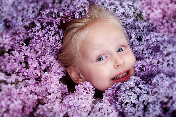 istock Child in lilac flowers 149465480