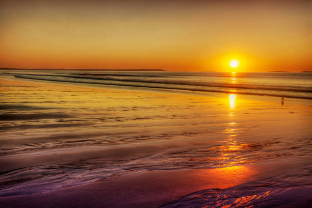 istock Rising sun on gold sands 1494658198