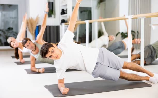 istock Young boy doing pilates in gym 1494660434