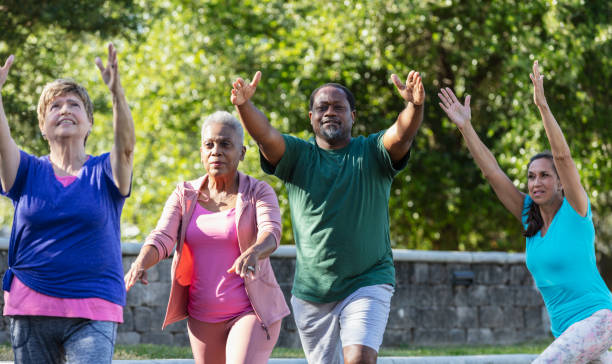 istock Mature African-American man in exercise class at park 1494661887