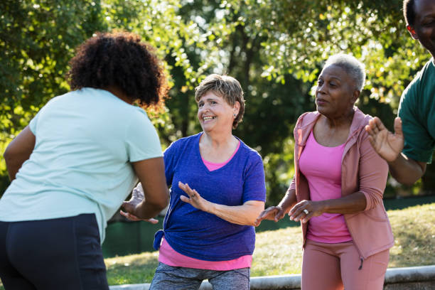 istock Two senior women enjoying exercise class at park 1494661899