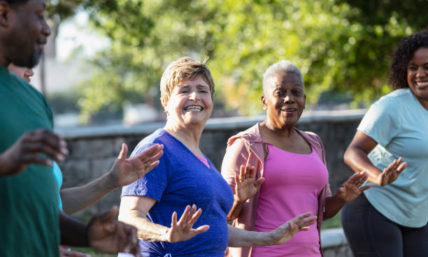istock Two senior women enjoying dance exercise class at park 1494661922