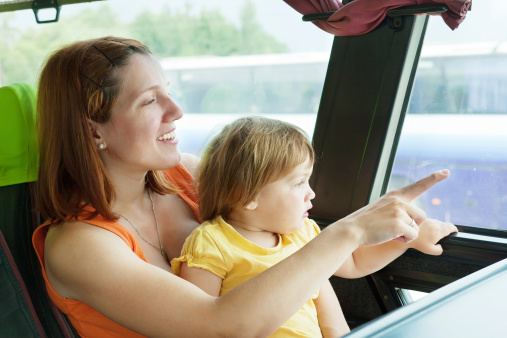 Mother and child traveling on commercial bus