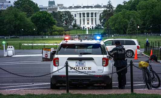 Secret Service officers on duty near the Ellipse in Washington D.C., ensuring the safety of the area.