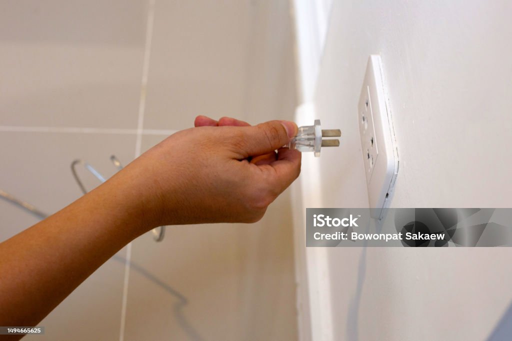 Cable Into Socket Hand Insert A Plug Into Socket Stock Photo - Download Image Now ...