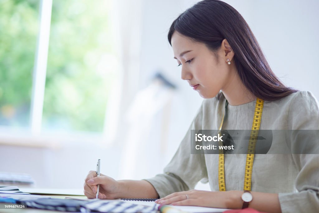 Japanese woman working as a fashion designer 20-29 Years Stock Photo