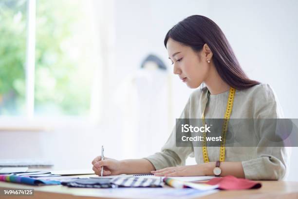 Japanese Woman Working As A Fashion Designer Stock Photo - Download Image Now - Employee, Fashion, 20-29 Years