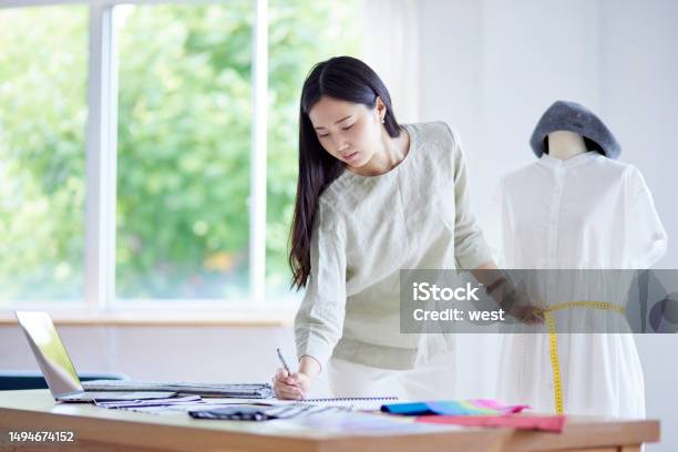 Japanese Woman Working As A Fashion Designer Stock Photo - Download Image Now - 20-29 Years, 25-29 Years, Adult