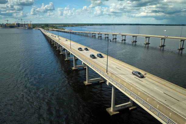 istock Barron Collier Bridge and Gilchrist Bridge in Florida with moving traffic. Transportation infrastructure in Charlotte County connecting Punta Gorda and Port Charlotte over Peace River 1494674561