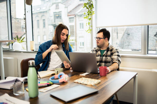 istock Young man presenting a business project to his diverse business team 1494677186