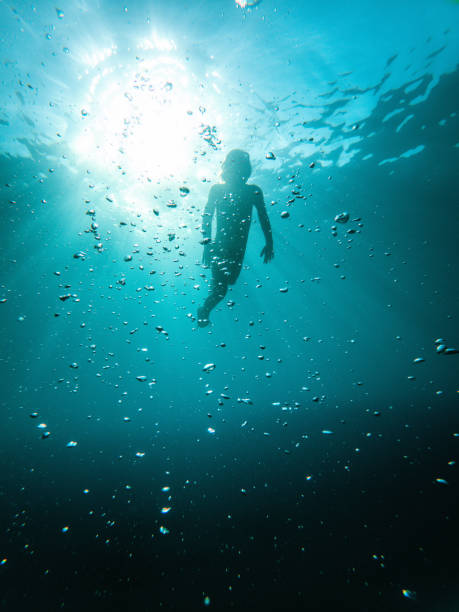istock Underwater Swim by a Cute White Child 1494679109