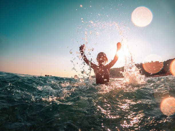 Boy's Summertime Enjoyment at the Beach
