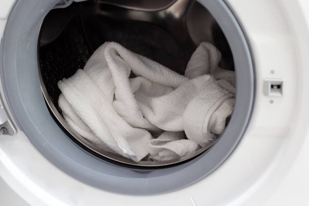 istock Used towel in washing machine 1494679837