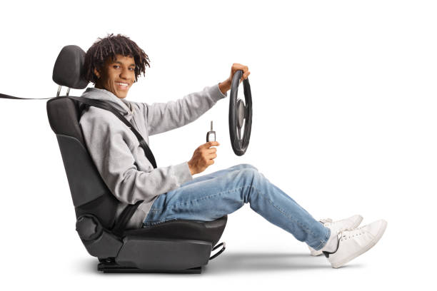 istock African american young man holding a steering and a key 1494682385