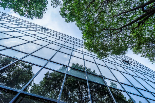 istock modern office building with green leaves 1494689400