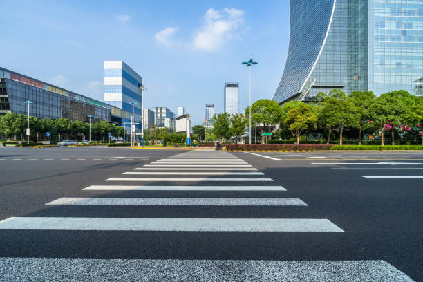 istock empty road with zebra crossing and skyscrapers in modern city 1494689426