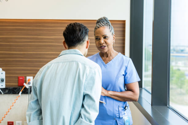 istock Female nurse explains the test results to the unrecognizeable young man 1494692718