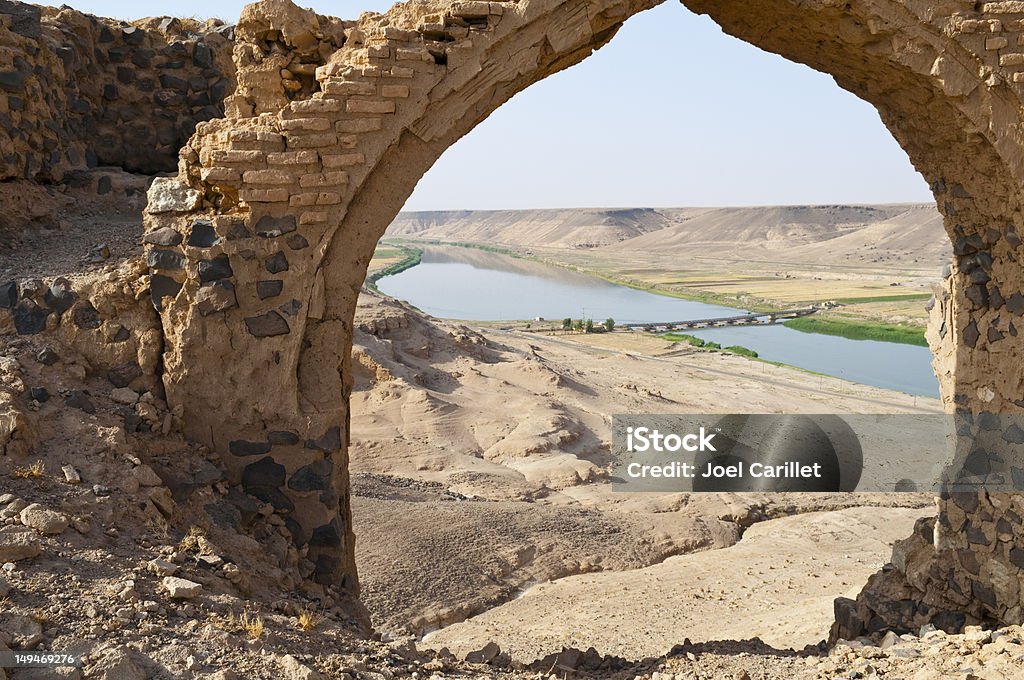 Euphrates River and Halabiye ruins Looking at the Euphrates River through the ruins of Halabiye Fortress in Syria, founded by Queen Zenobia in the 3rd century AD. Euphrates River Stock Photo