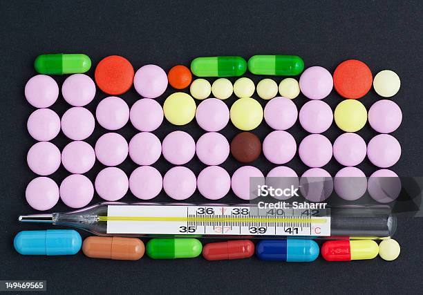 Pills And Thermometer Stock Photo - Download Image Now - Antibiotic, Black Color, Capsule - Medicine