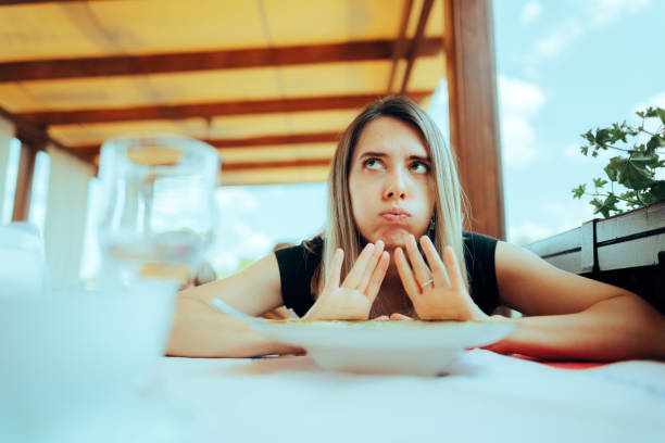 istock Woman Refusing to Eat her Meal Feeling Full 1494704238