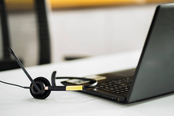 istock VOIP headset and notebook computer phone concept for communication support Call Center and Customer Service 1494706498