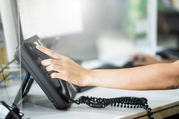 istock Customer support phone operator in headset Call center worker hand typing on keyboard at desktop Counseling and support center 1494706523