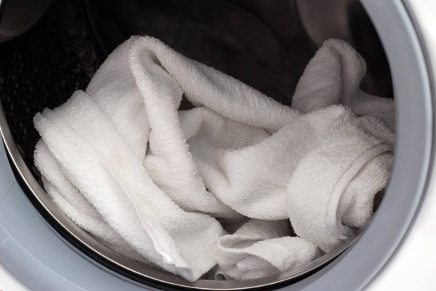 istock Used towel in washing machine 1494706699
