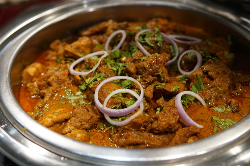 Rogan josh on steel plate close up