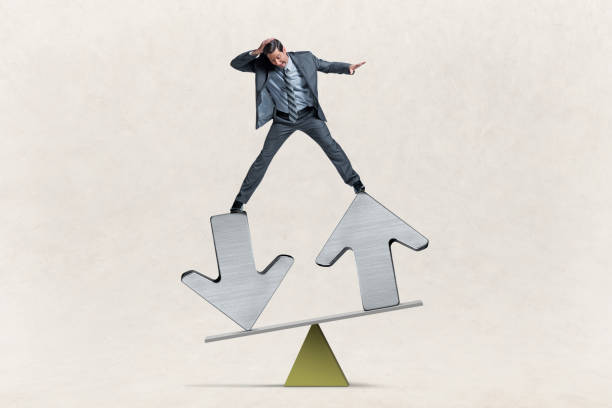 istock Man Balances On Arrows On A Seesaw 1494709523