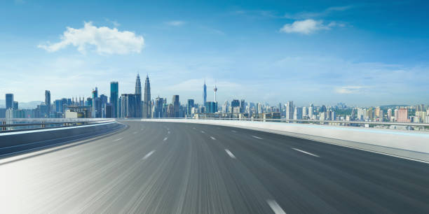 Highway overpass motion blur with city