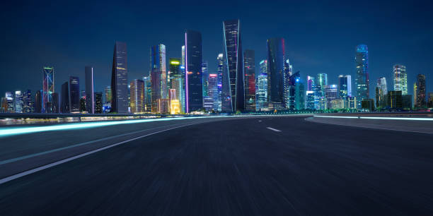 istock Highway overpass motion blur with city 1494711078