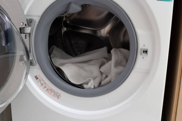 istock Used towel in washing machine 1494711188