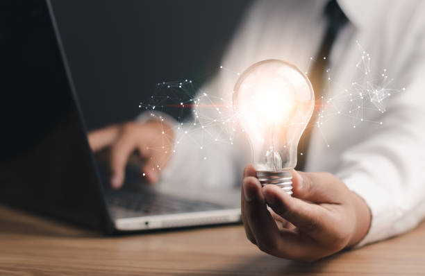 istock Creative thinking ideas and innovation technology, inspiration concept. Businessman holding light bulb,Idea and imagination,Solution analysis and development network connection. 1494713861