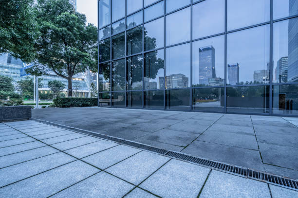 istock buildings and clean road reflected on the glass wall 1494714193