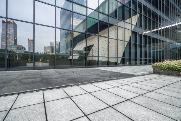 istock buildings and clean road reflected on the glass wall 1494714194