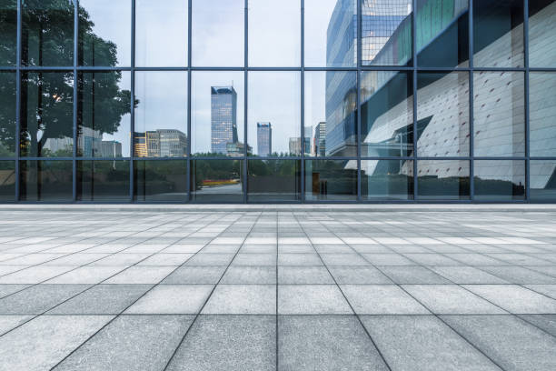 istock buildings and clean road reflected on the glass wall 1494714196