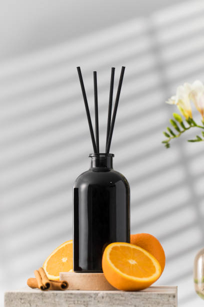 istock Black glass diffuser with the scent of cinnamon, orange. Perfumes for the room 1494715044