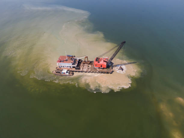 istock Vessels clearing channel silt 1494715842