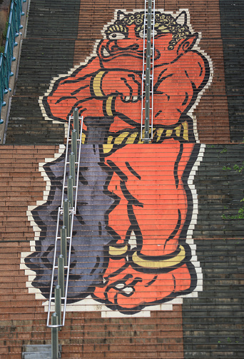 Kinugawa, Japan, May 3 2023: a oni painting on a staircases  in Kinugawa Onsen.  An oni is a kind of demon, orc, ogre, or troll in Japanese folklore. it is also the sources of name to Kinugawa, literally \