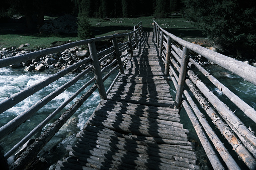 Footbridge over the mountain river