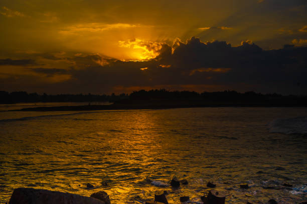 Tetrapods or breakwaters on the Glagah Beach, Kulonprogo, Indonesia during sunrise. stock photo