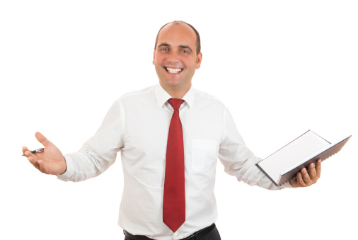 employee holding black notebook and pen on white background