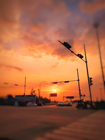 defocused sunset on street junction, located in Karanganyar regency, Jawa Tengah province of Indonesia