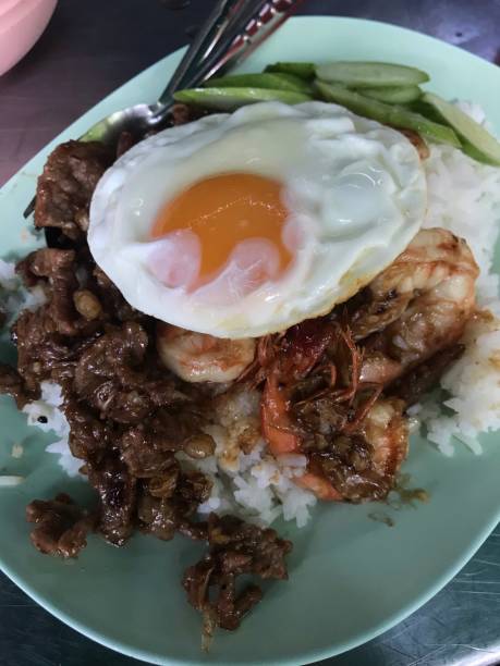 istock Fried beef and shrimps with garlic serve with rico and fried egg on top 1494724767
