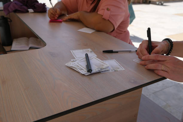 istock Women's hands write wishes on paper. Close-up. Wailing Wall in Jerusalem. Israel. 1494725321