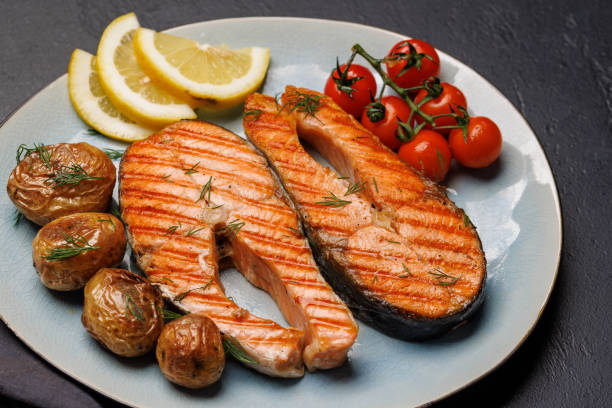 istock Grilled salmon steaks and potatoes 1494726055