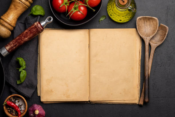 istock Top-down view of a kitchen table with ingredients, utensils, and an open cookbook 1494726212